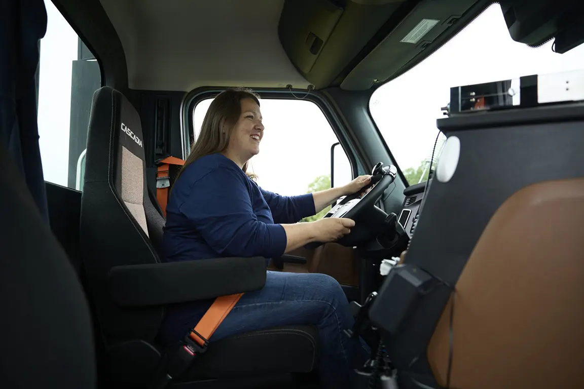 Woman Truck Driver Driving a Semi Truck
